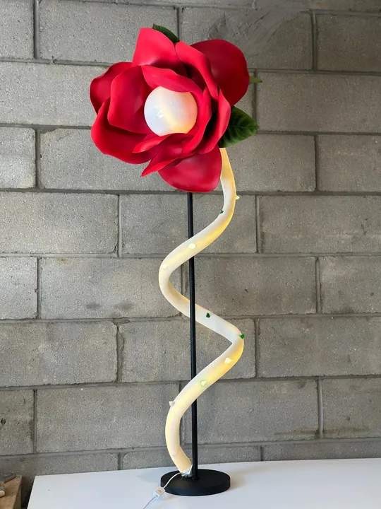 Red rose sculptural lamp on a spiraling illuminated stem